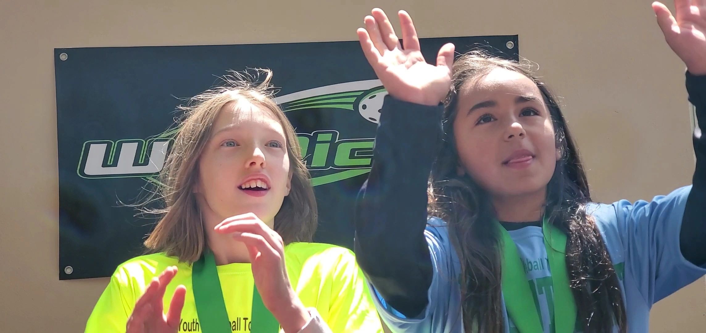 Children waving at WePickle sports event