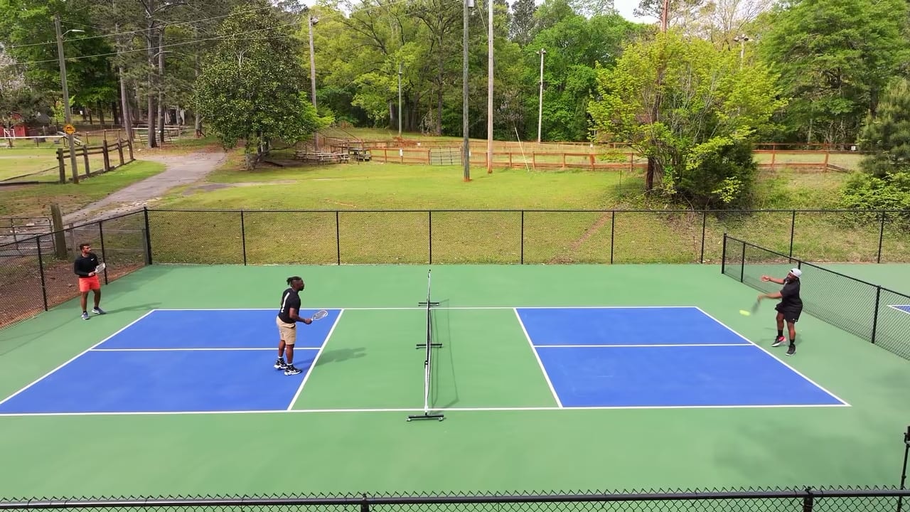 People playing pickleball on outdoor courts