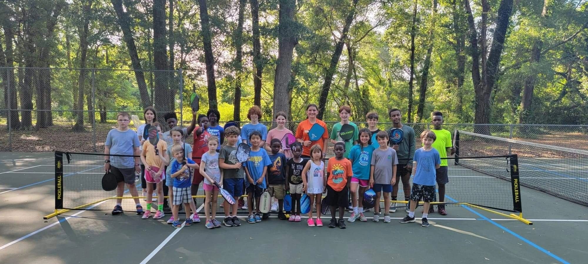 WePickle Our Programs — kids on pickleball court